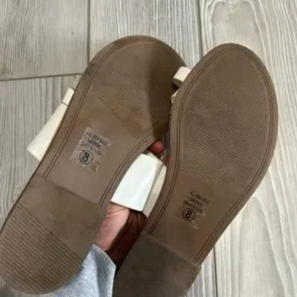 Soda white size 8 up on sandals very small stain to right shoe as pictured